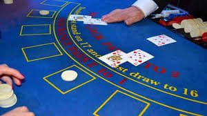Close-up of live roulette wheel with betting table layout on screen